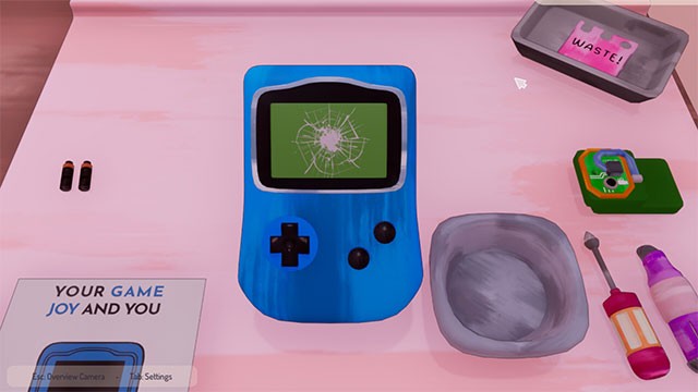 Little Repair Shop mô phỏng sửa chữa máy chơi game cầm tay ở góc nhìn top-down